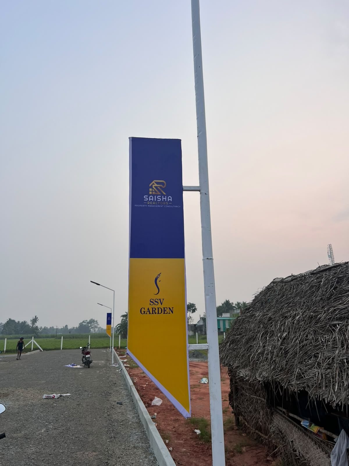 SSV Garden and Saisha Realtors branding on the site sign post